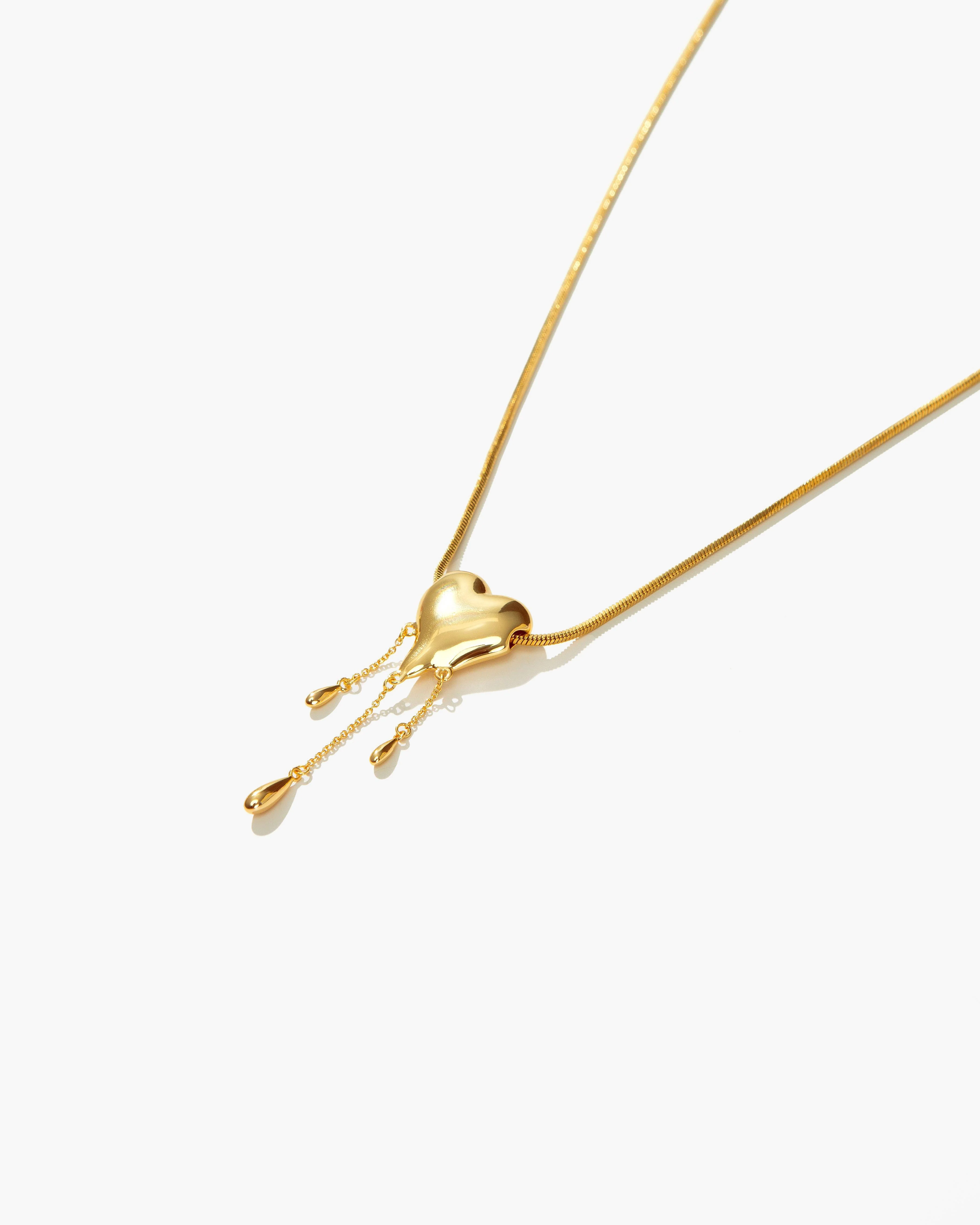 Venom’s Golden Drip Heart Necklace - Image 3